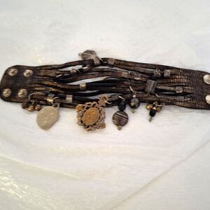 A Woman's Leather Cuff Bracelet Charms Steampunk Strappy Grunge Streetwear